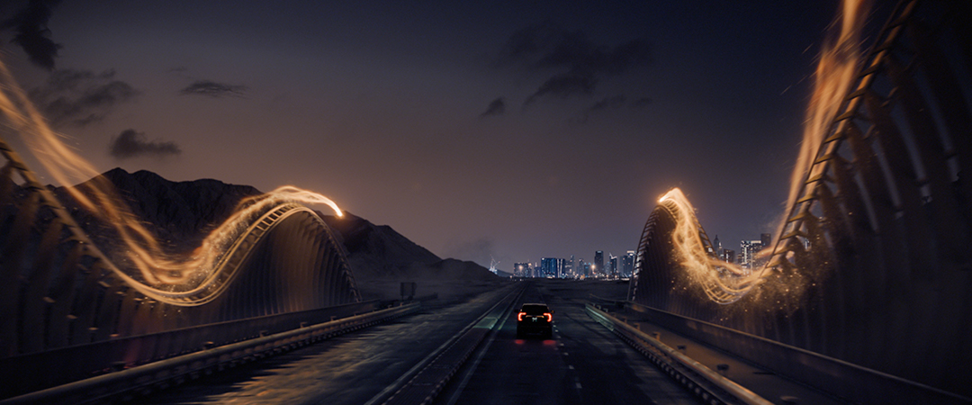 A car going over a bridge guided by two sparking trails of light